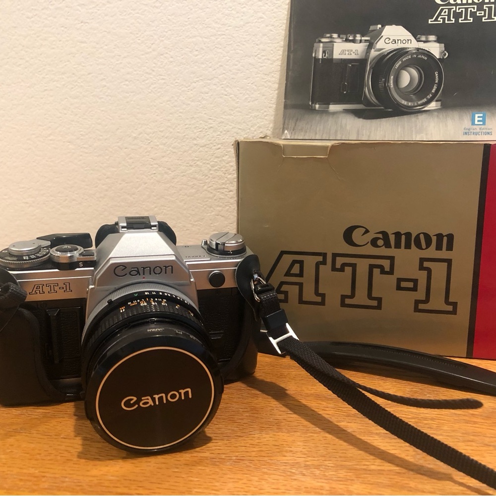 Canon AT-1 35 mm SLR camera with case and accessories. Excellent condition.